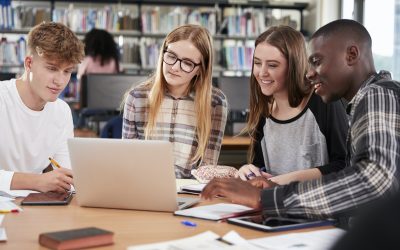 group-of-college-students-collaborating-on-project-in-library.jpg